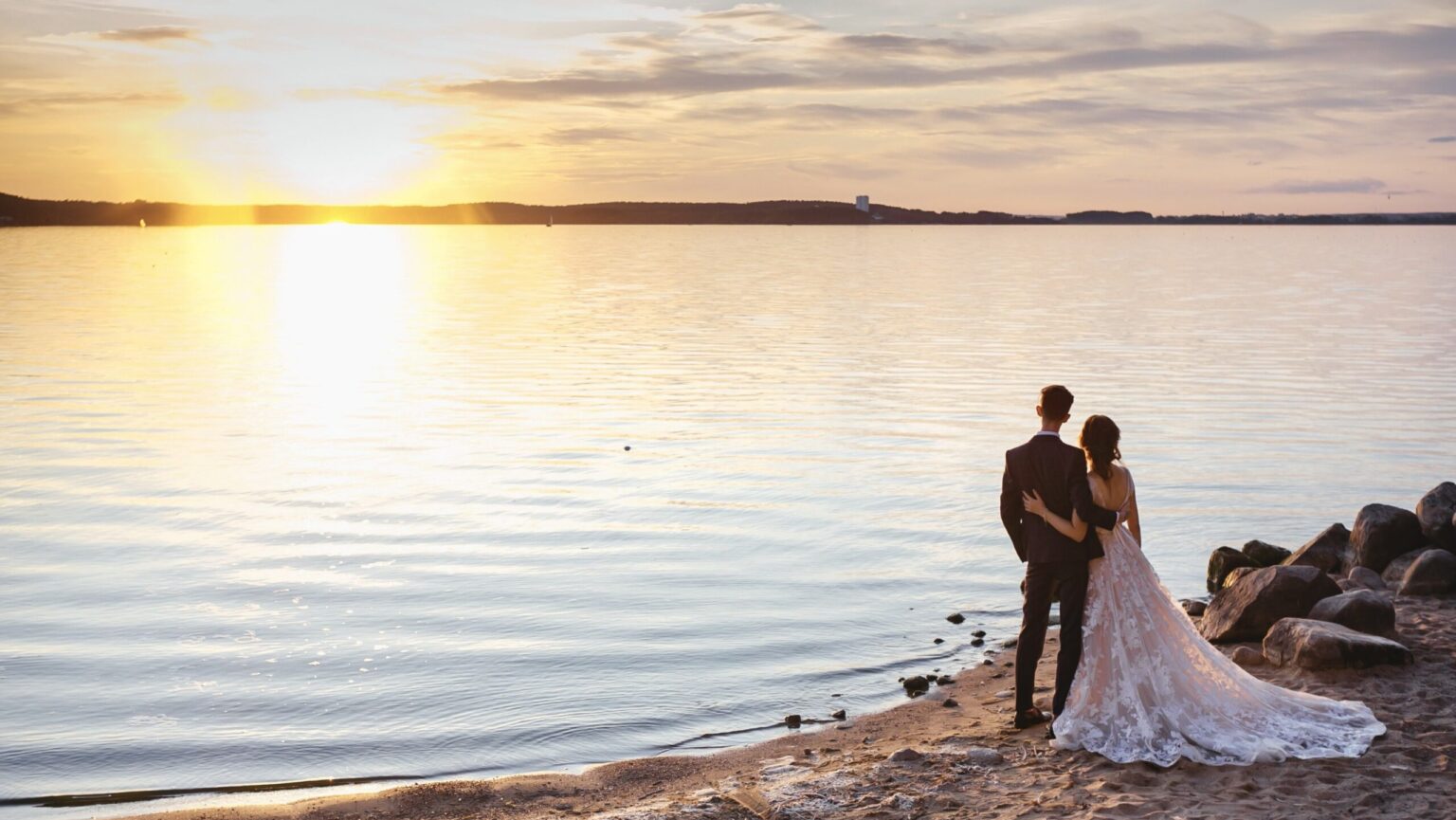 Romantic couple on the beach during sunset at wedding photoshoot in Crete